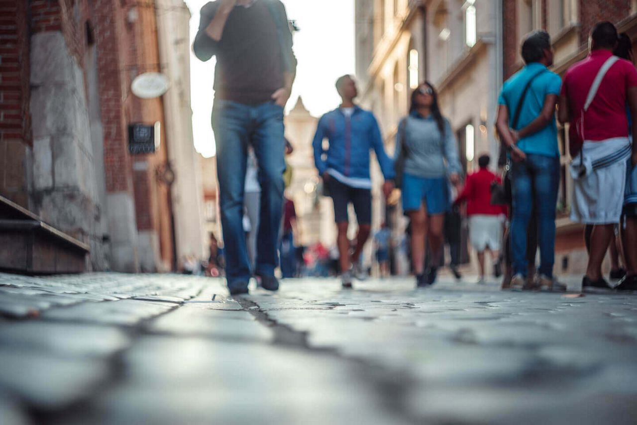 Blurred people walking and standing on European street; Shutterstock ID 705694345; Purchase Order: Batch2