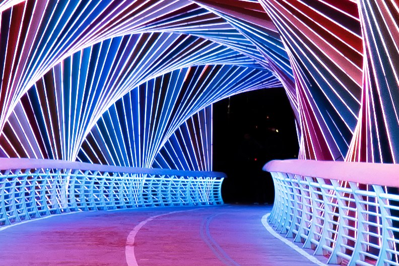 A bridge with colorful lights on it