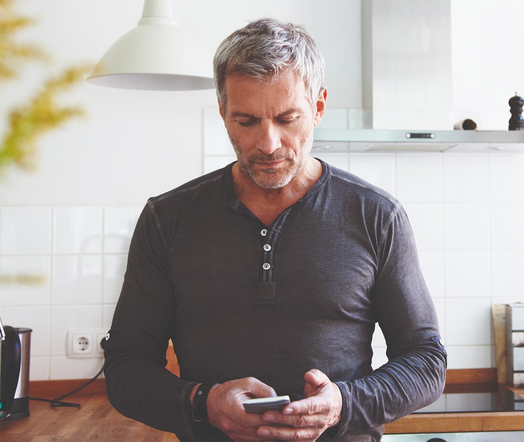 Man typing on his mobile