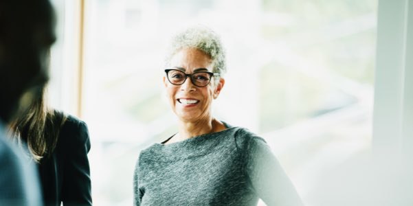 Female Financial Adviser with glasses and smiling