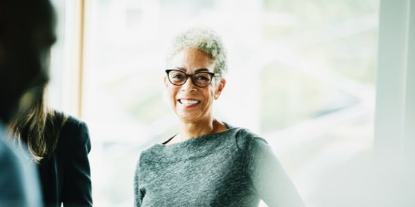 Female Financial Adviser with glasses and smiling