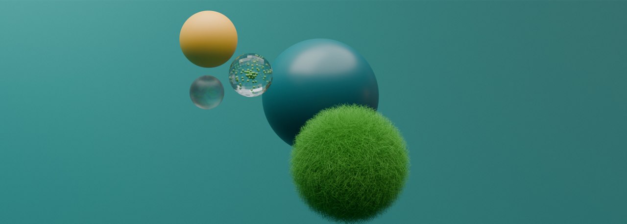Green grass ball and two spheres on blue backdrop