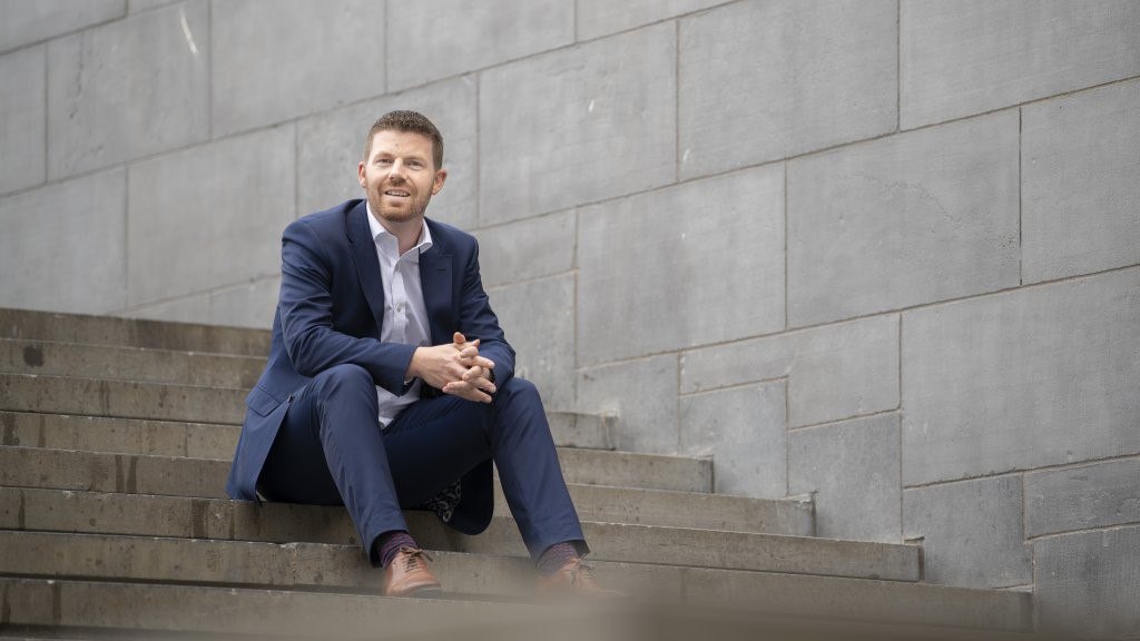 man seating on stairs