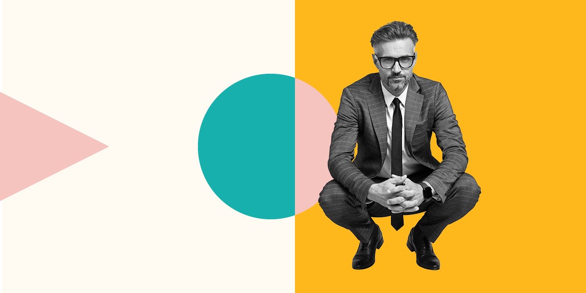 A person sitting in squat position in specs with an abstract background