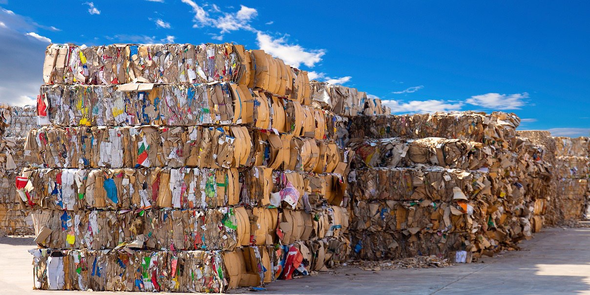 Stack of paper waste before shredding at recycling plant