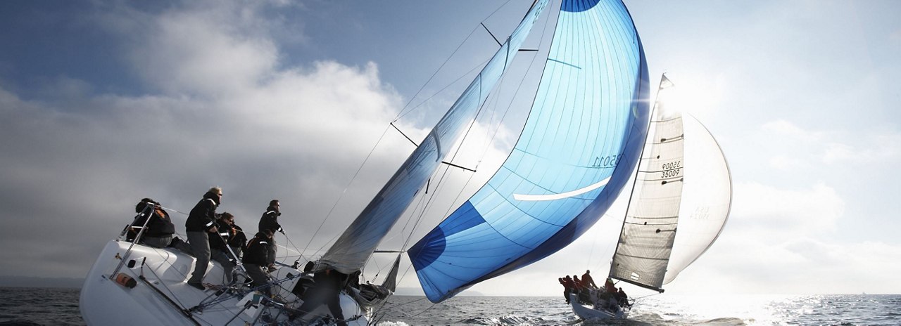 two sailboats racing on the open sea