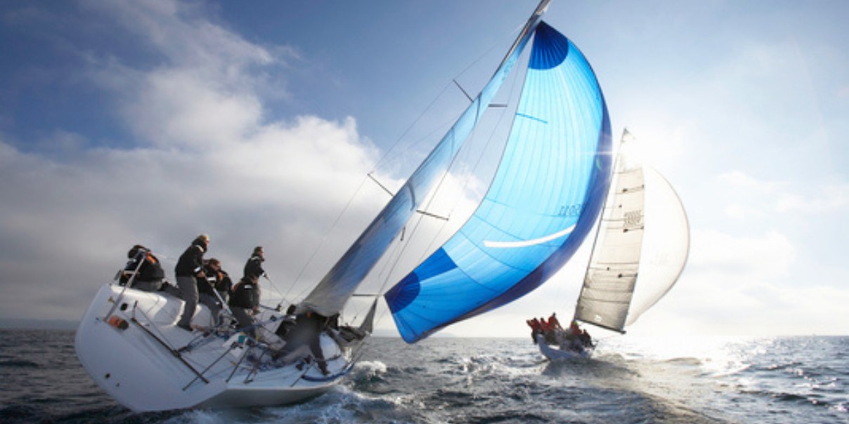 two sailboats racing on the open sea