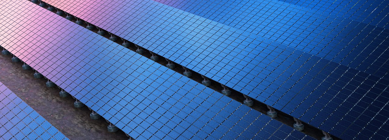 Rows of blue and purple solar panels arranged in parallel lines, mounted on a flat surface, capturing sunlight for renewable energy generation.