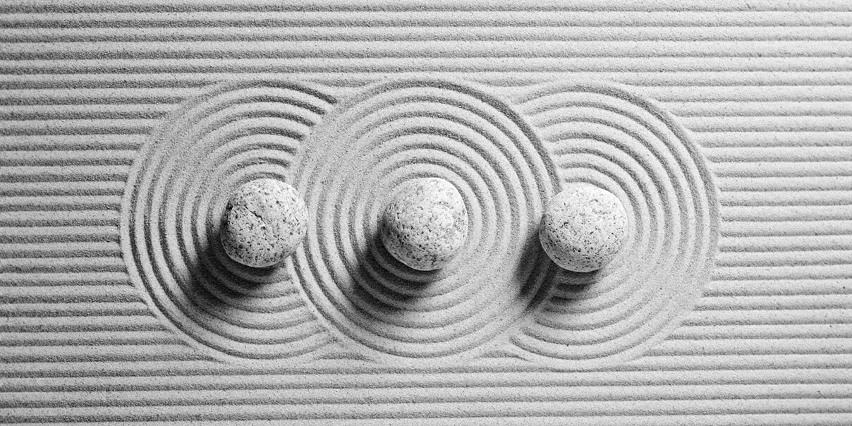Sand art with 3 balls made out of sand