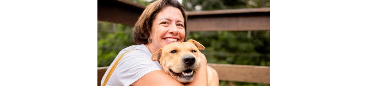 Women smiling with her dog