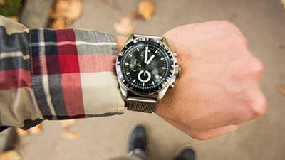 A close-up of a person's wrist adorned with a stylish watch, showcasing its elegant design and craftsmanship.