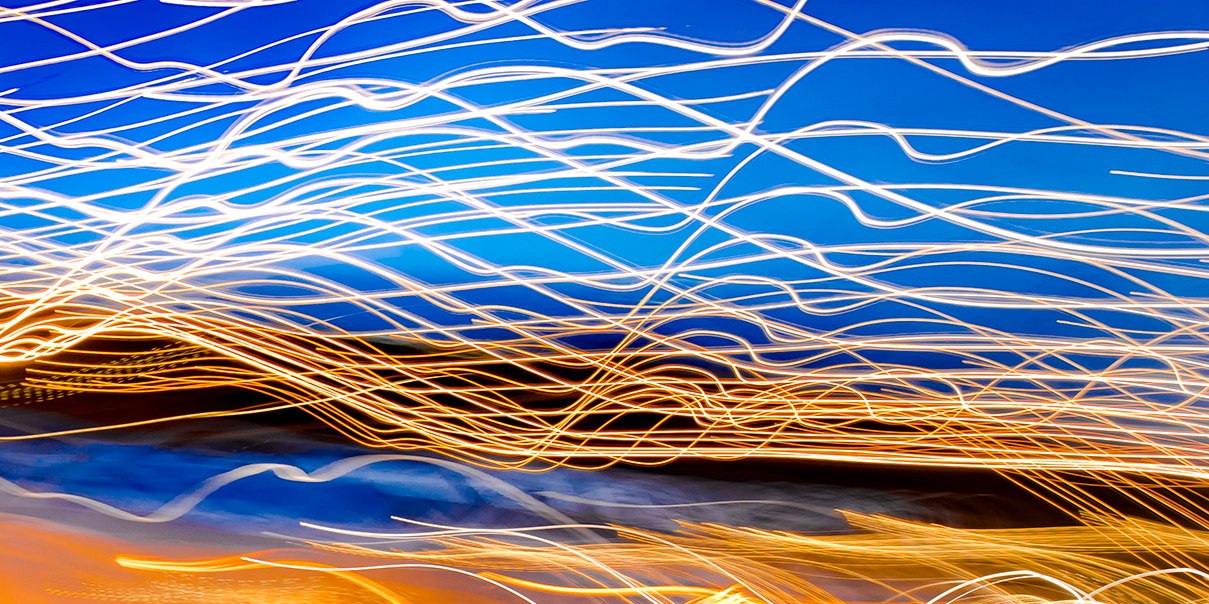 Time Exposure of skaters having fun, depicting motion, leisure activity, Winter Holiday season and artistic vision.