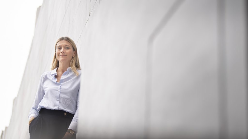 woman leaning wall