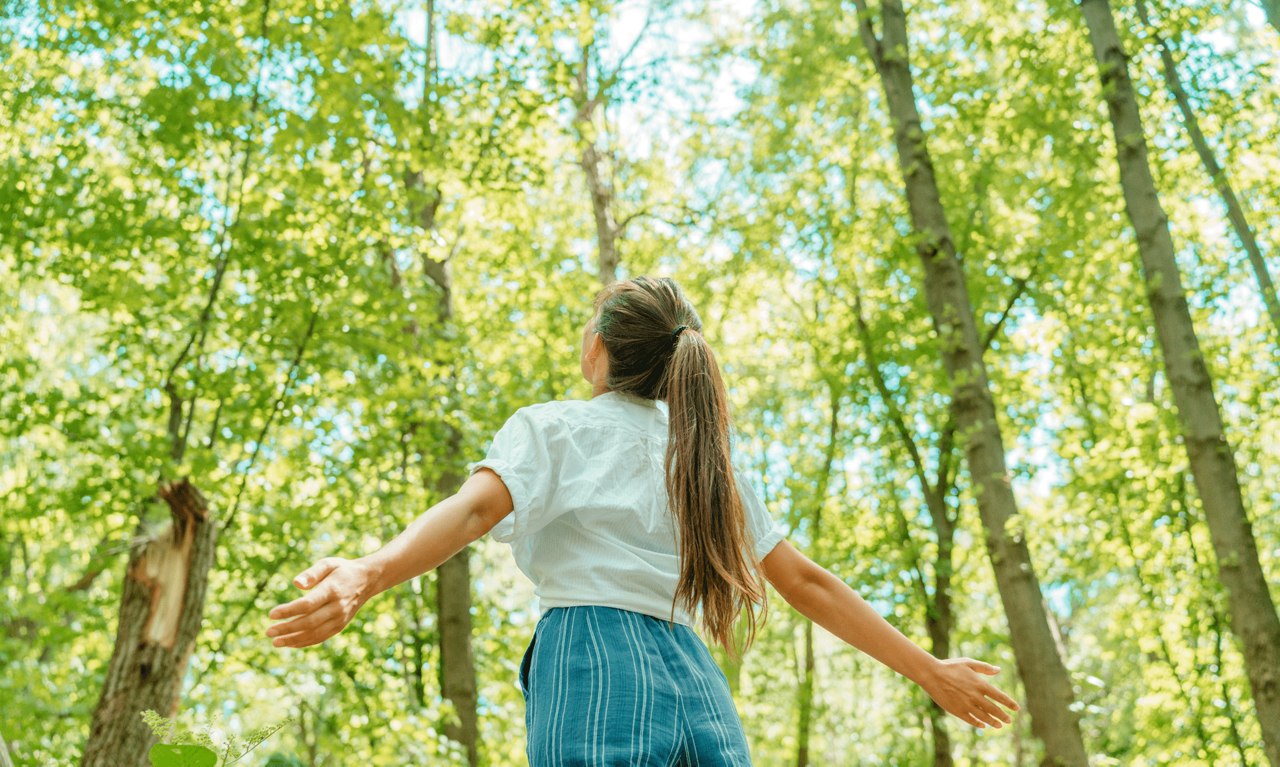 women surrounded by trees